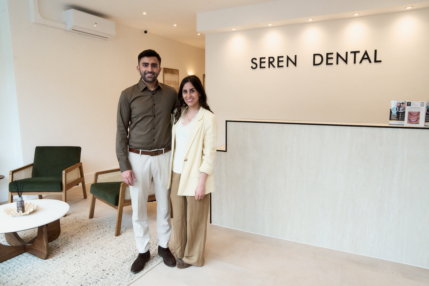 Dr Devin and Dr Rozie at the Seren Dental reception desk, a private dental practice in Penylan, Cardiff